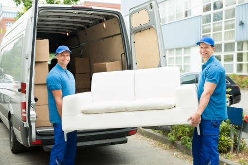 Local removal team preparing a house move in a residential street