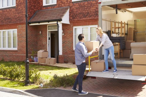 Organized house relocation process with careful packing and loading