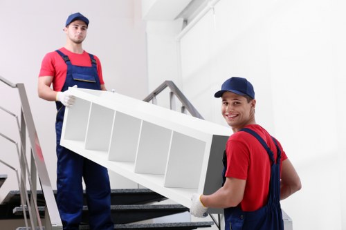 Man with a van loading household furniture in House