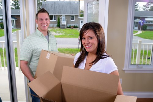 Removal van and packed boxes outside a residential house