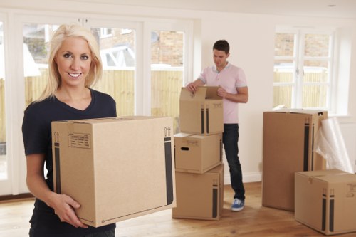 Removal team sorting packing waste for recycling during a house move