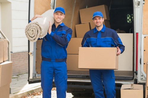 Professional domestic removals service handling furniture with care