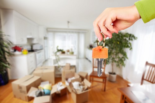 Moving team unloading household items at a new property