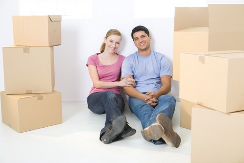 Removal team helping with a house move outside a local home