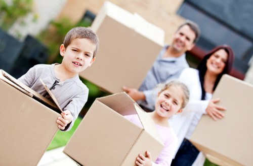 Local movers handling furniture and boxes for a house removal