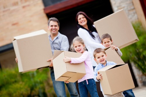Prepared office relocation checklist and labelled moving boxes