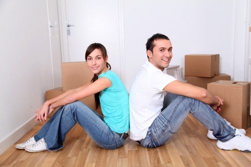 Prepared boxes and furniture ready for a house removal by van