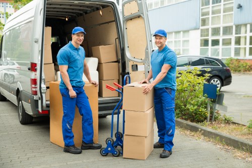 Packing and loading household items into a removals van