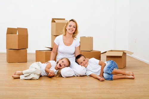 Careful movers navigating stairs and tight access during a house removal in House