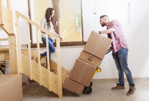 Packed moving boxes and furniture ready for transport during a house relocation