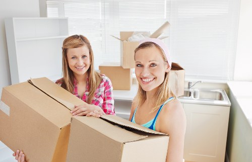 Furniture and boxes being loaded by a local moving team